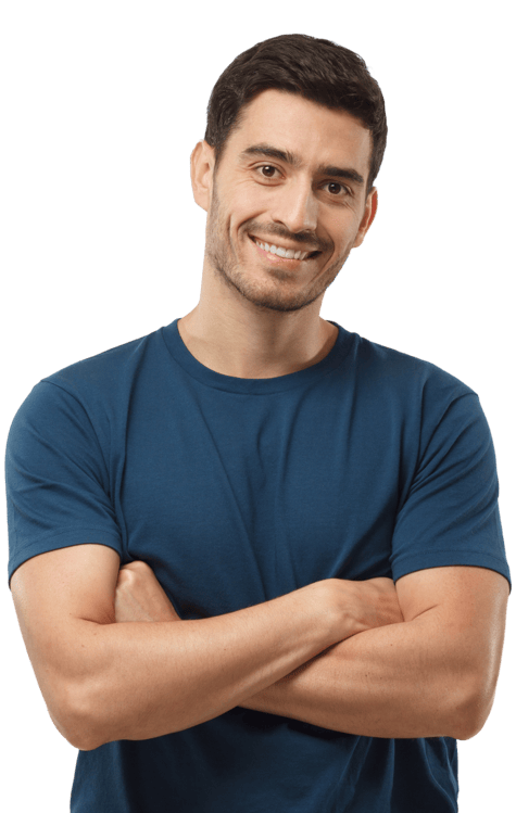 man in a blue shirt smiling with his arms crossed in front of him